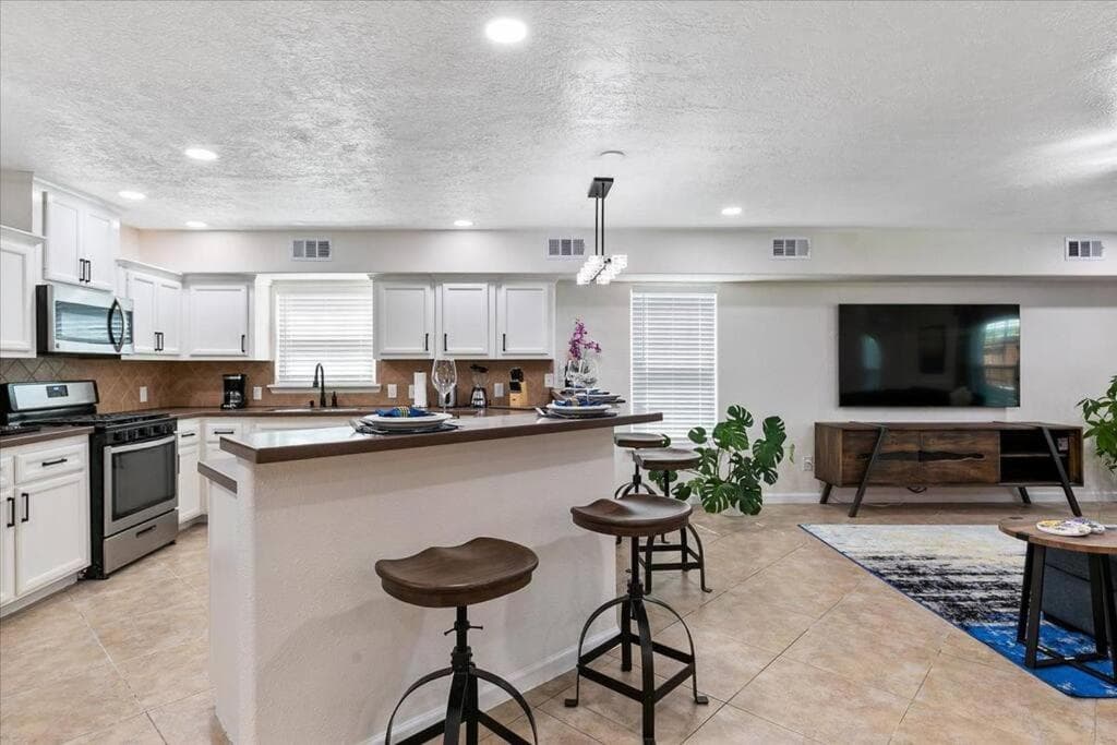 Photograph supplied for Bring the Crew! 4BR Luxe Pad, Backyard Magic & City at Your Door